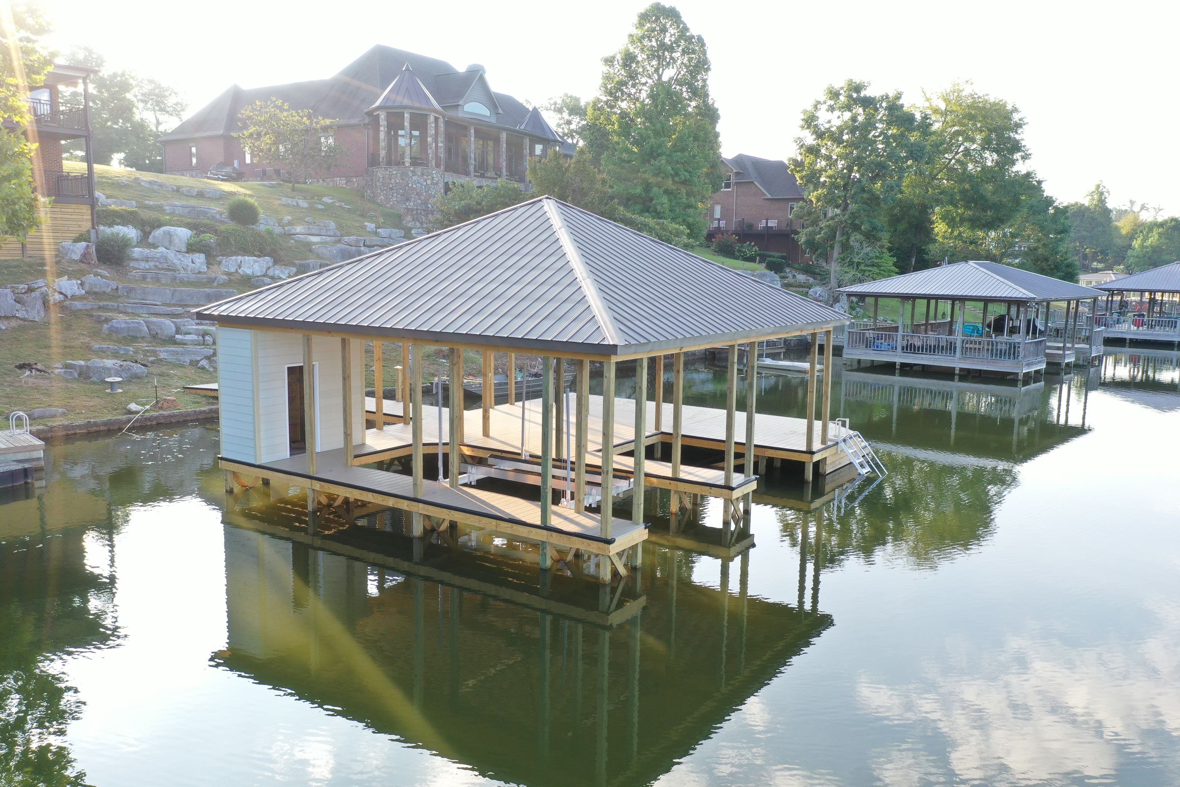 Blue Horizon Docks and Decks founders Christian and Sergio Rodriguez at a Tennessee lake build