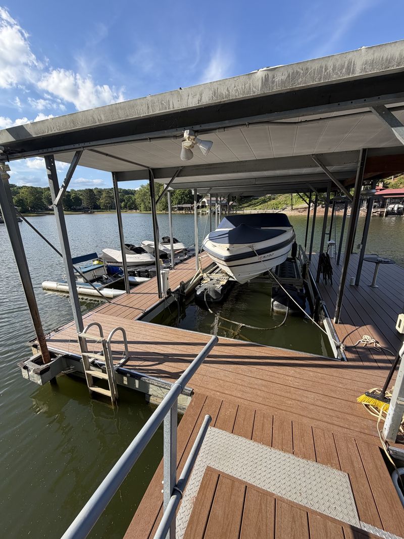 Composite-decked covered slip with an aluminum gangway