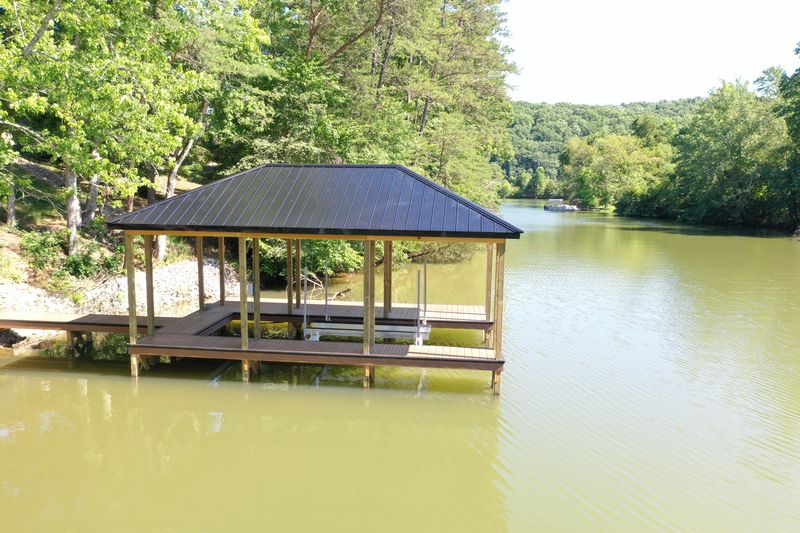 Aerial view of a covered pavilion boathouse on a Tennessee lake