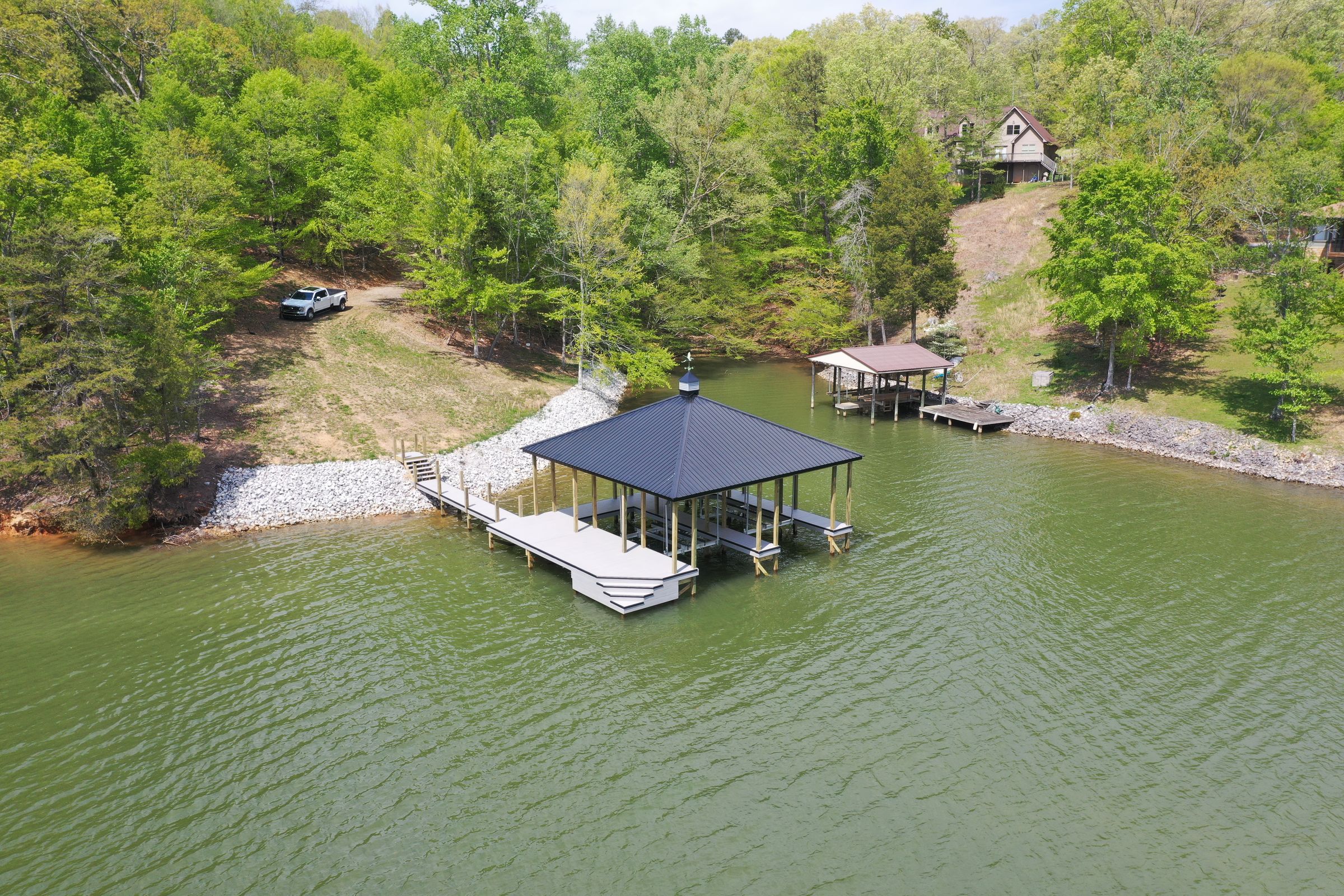 Aerial of a custom boathouse on the water near Kingston, TN — Blue Horizon Docks and Decks